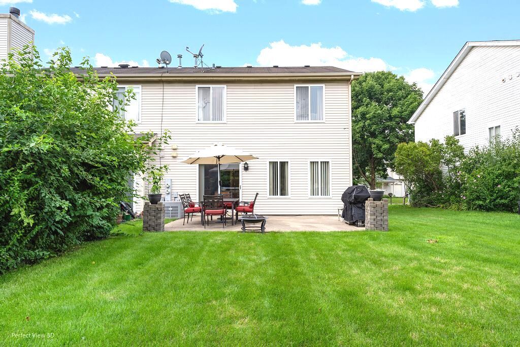 22202 West Niagara Trail, Unit 22202 Plainfield, IL 60544 - Photo 2 of 24 a view of a house with a yard and sitting area