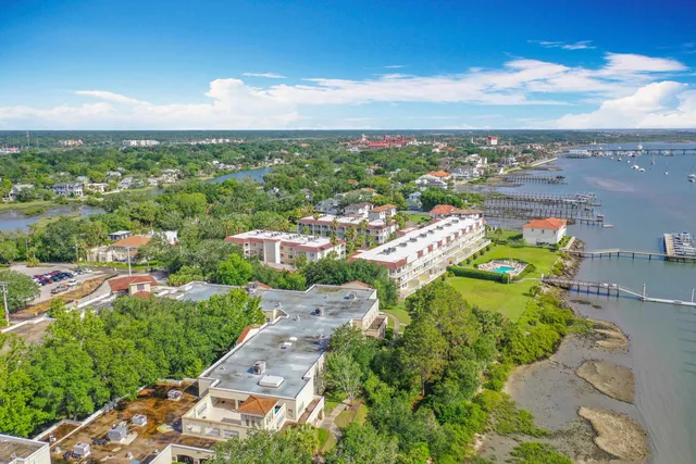 a view of a hallway with wooden floor and entryway