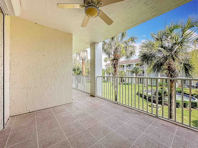a aerial view of a swimming pool and outdoor seating