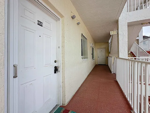 a view of a hallway with some storage area