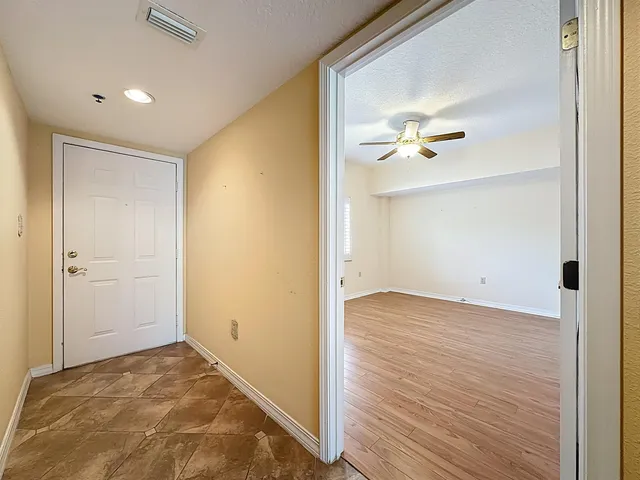 a large bathroom with a double vanity sink a mirror and a bathtub