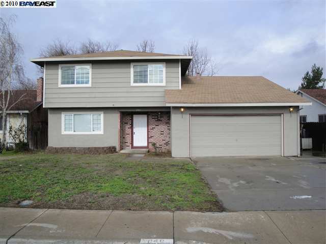 840 West Cypress Road Oakley, CA 94561 - Photo 1 of 1 a front view of a house with a yard and garage
