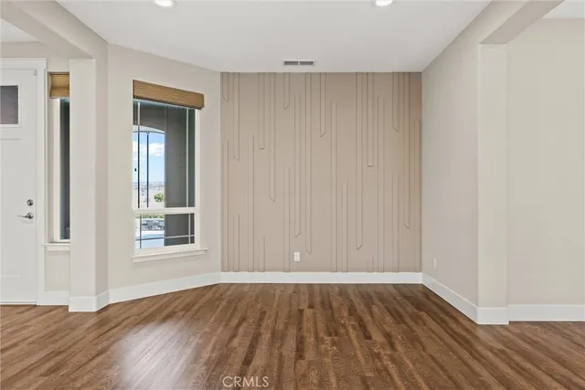 a living room with a flat screen tv and a fireplace