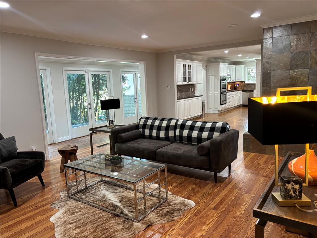 45 Blackland Road Northwest Atlanta, GA 30342 - Photo 18 of 31 a living room with furniture and a flat screen tv