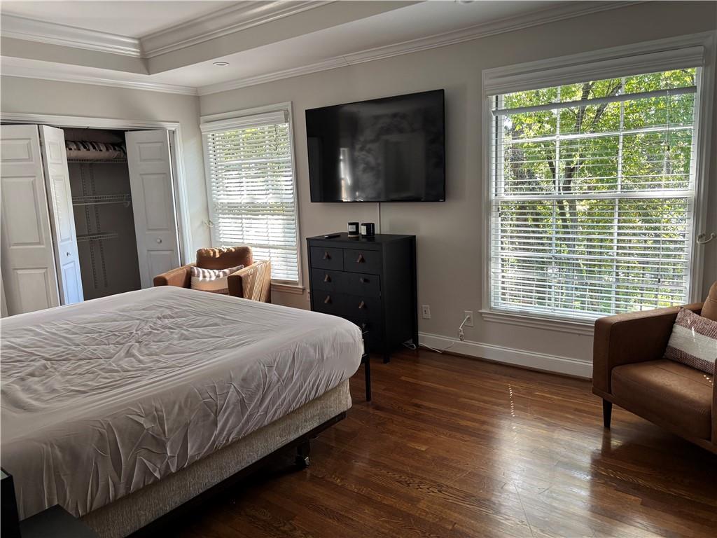 45 Blackland Road Northwest Atlanta, GA 30342 - Photo 21 of 31 a bedroom with a bed and a flat screen tv