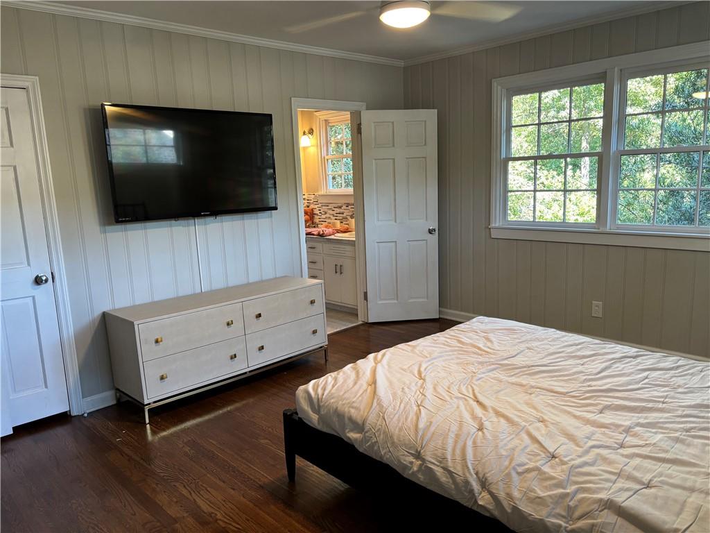 45 Blackland Road Northwest Atlanta, GA 30342 - Photo 27 of 31 a bedroom with a bed and a flat screen tv