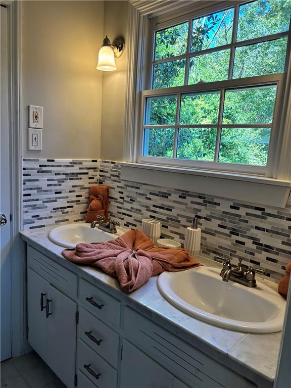 45 Blackland Road Northwest Atlanta, GA 30342 - Photo 28 of 31 a bathroom with a sink and a mirror