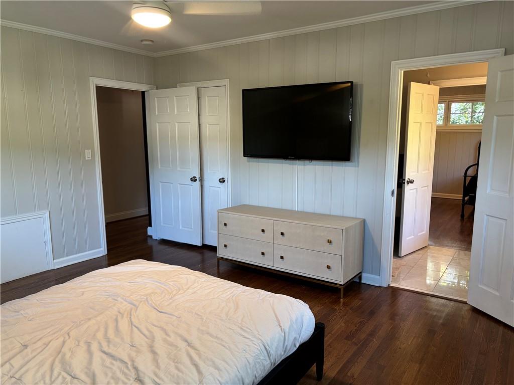 45 Blackland Road Northwest Atlanta, GA 30342 - Photo 30 of 31 a bedroom with a bed and a flat screen tv