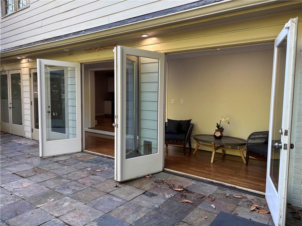 45 Blackland Road Northwest Atlanta, GA 30342 - Photo 4 of 31 a view of a patio with a table and chairs