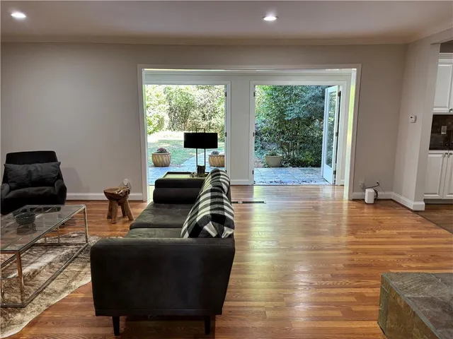a workspace with wooden floor and a window