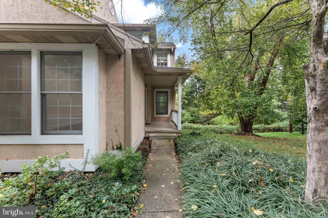 a view of a pathway besides a house