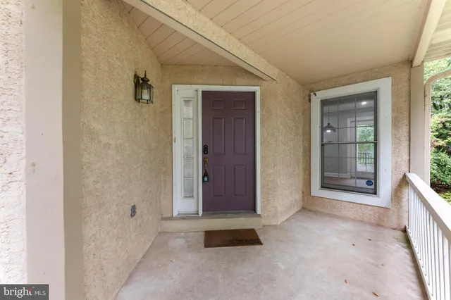 a view of house with a deck