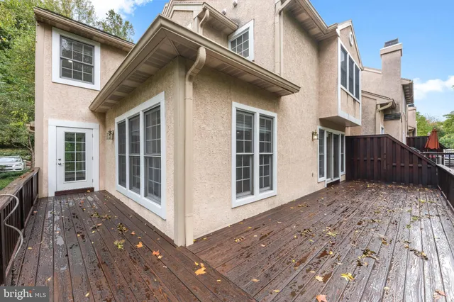 a view of balcony with wooden floor