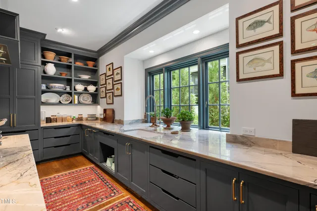 a kitchen with stainless steel appliances granite countertop a stove and a sink