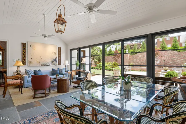 a outdoor dining space with furniture and potted plants