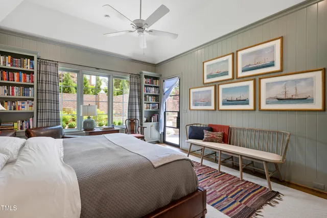 a spacious bathroom with a tub a sink and a window