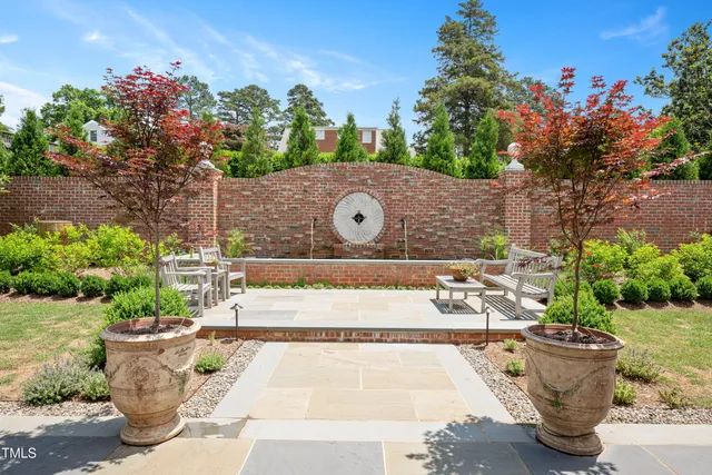 a view of a chairs and table in the yard