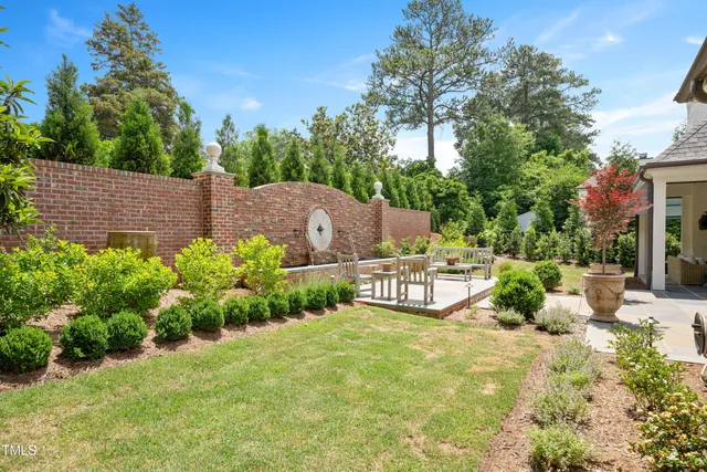 a view of a backyard with sitting area