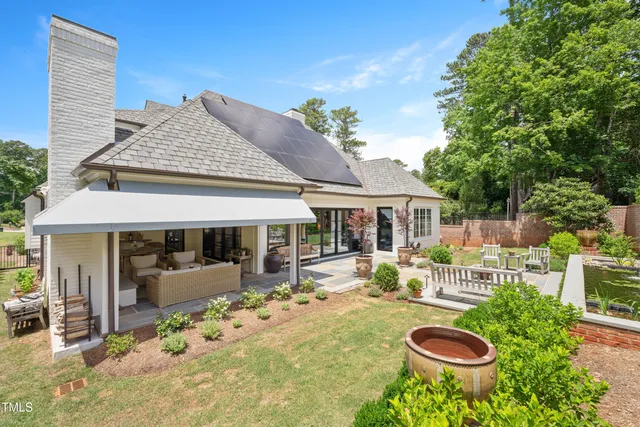 an aerial view of residential house with outdoor space and parking