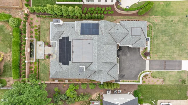 an aerial view of residential house with outdoor space and swimming pool