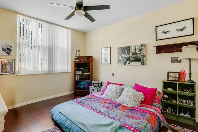 a bedroom with a bed and a bookshelf