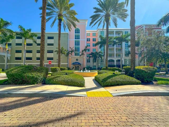 a view of a swimming pool with a garden and plants