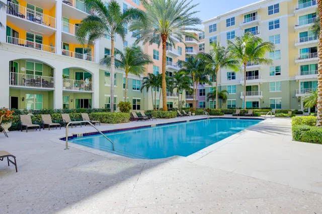 a view of a swimming pool with a lounge chairs