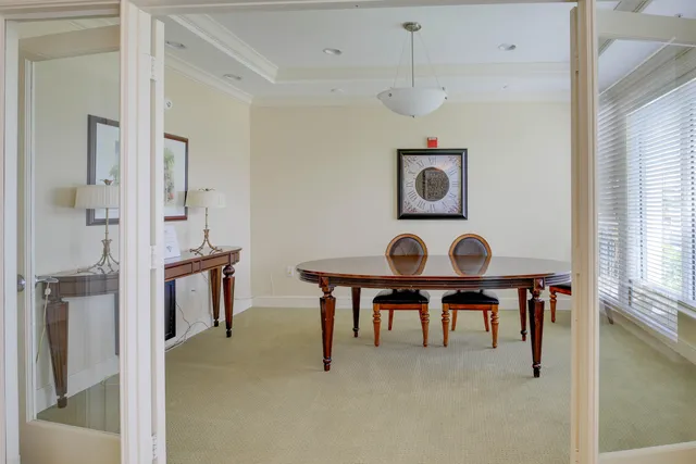 a view of kitchen with cabinets table and chairs