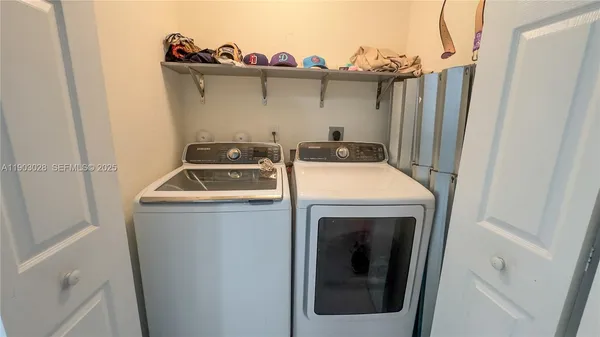 a utility room with dryer and washer