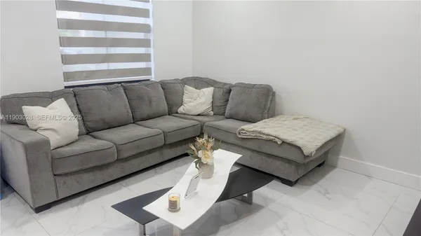 a living room with furniture and a couch