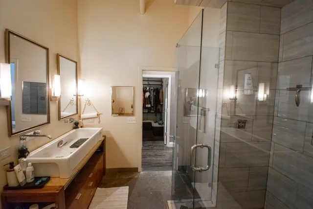 a bathroom with a sink and mirror