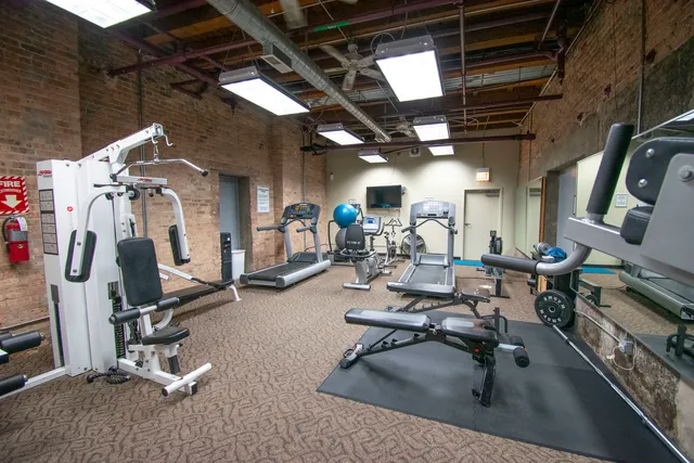 a view of a patio with a table and chairs