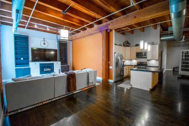 a view of kitchen with cabinets and wooden floor