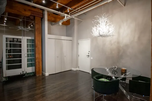 a room with wooden floor and furniture