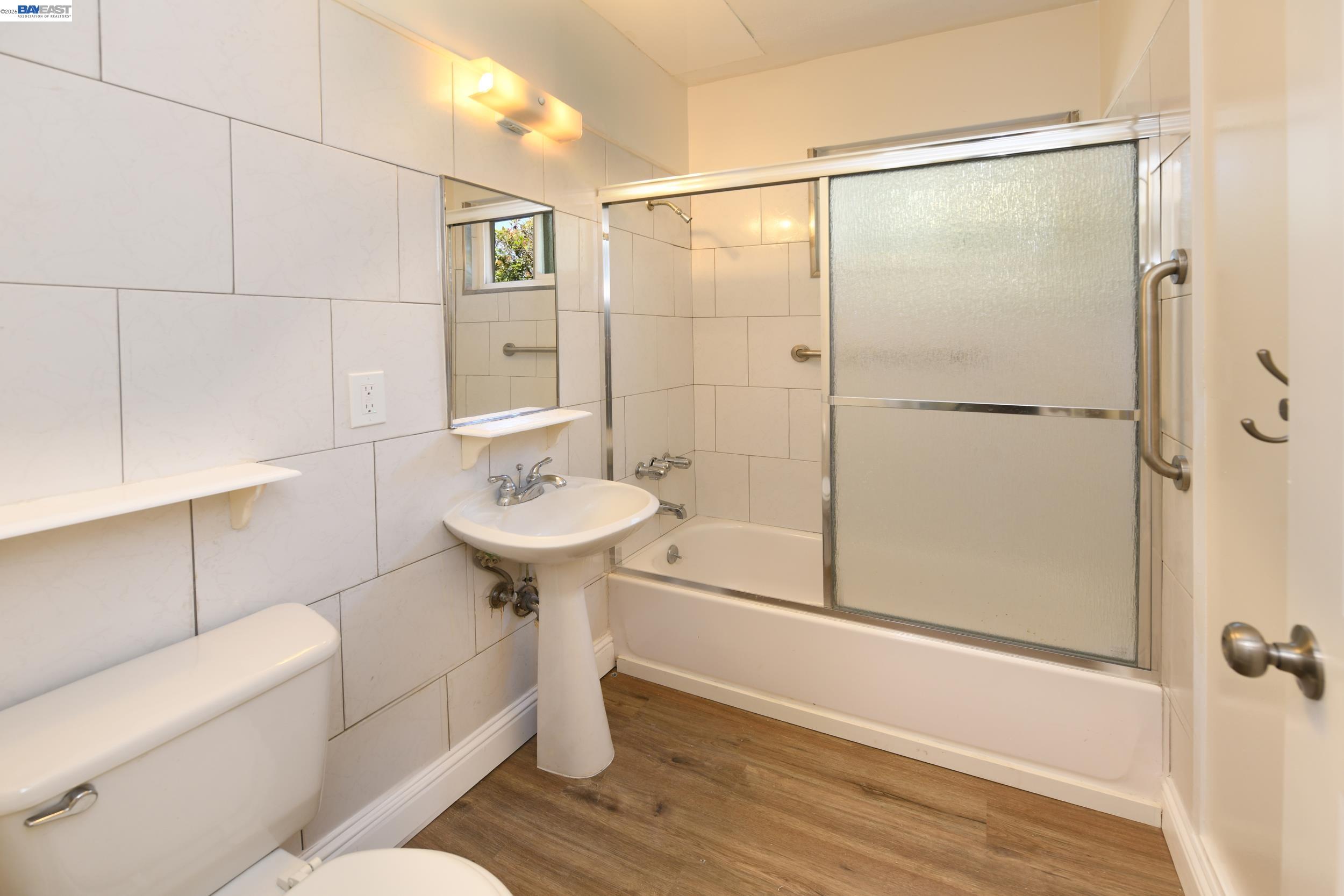 205 Muir Road Martinez, CA 94553 - Photo 13 of 20 a bathroom with a sink toilet and shower