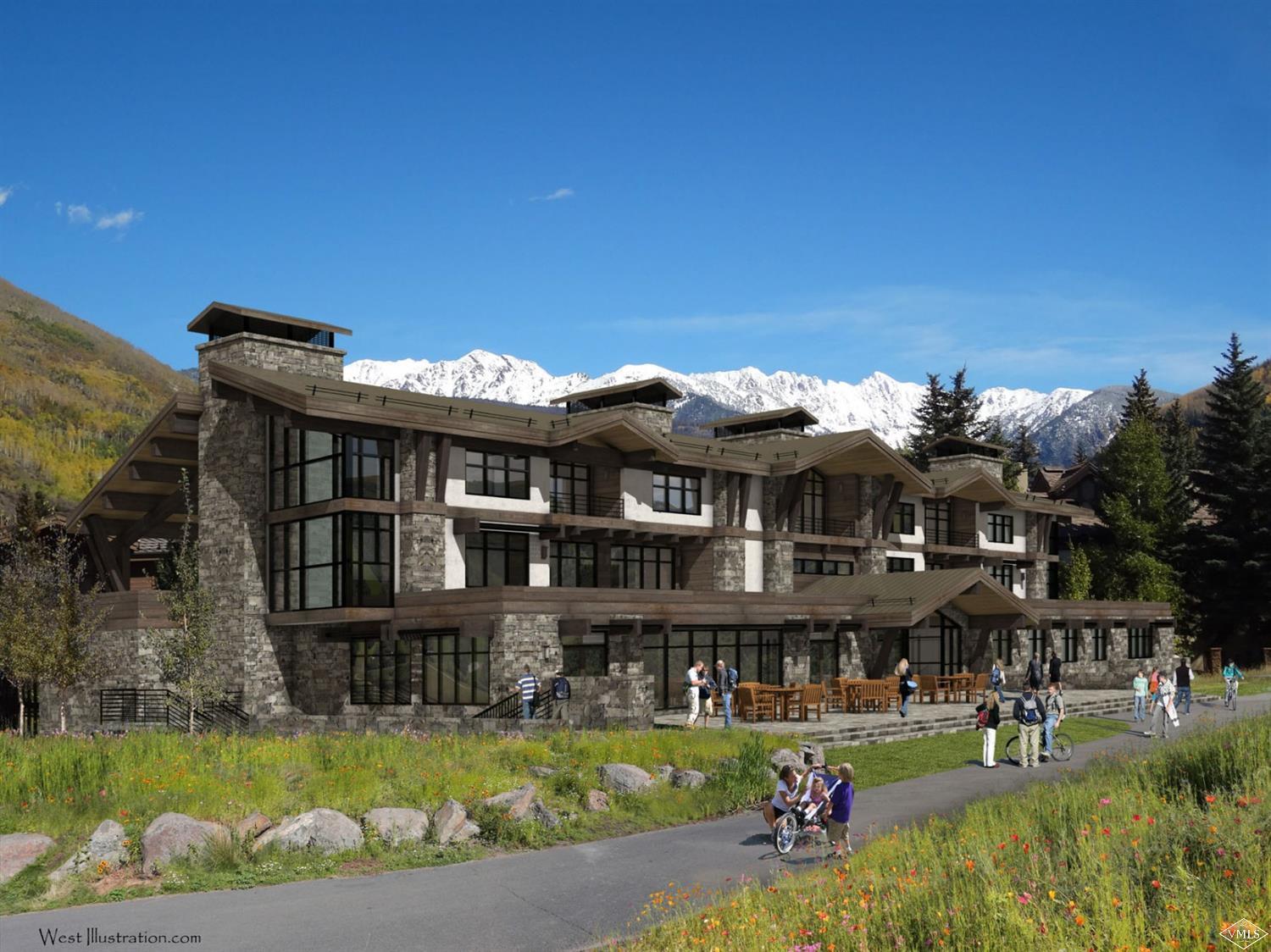 598 Vail Valley Drive, Unit R2 Vail, CO 81657 - Photo 2 of 5 a front view of a house with a garden and swimming pool