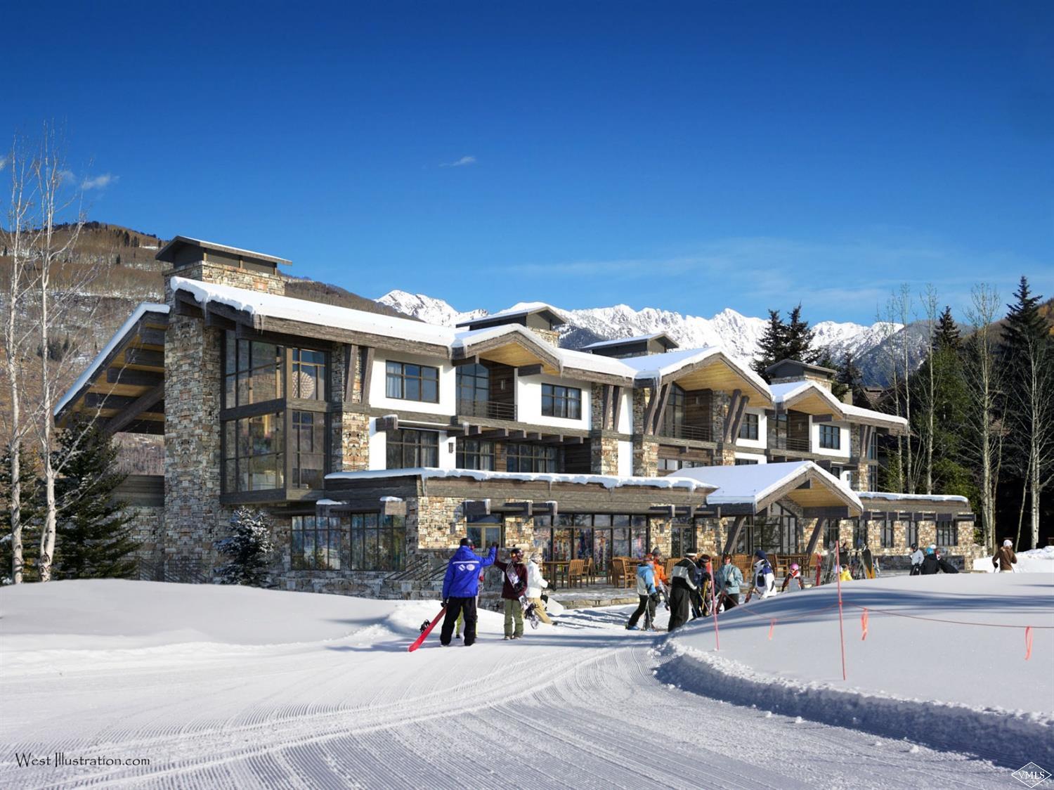 598 Vail Valley Drive, Unit R2 Vail, CO 81657 - Photo 5 of 5 a view of a building with a bench in front of it