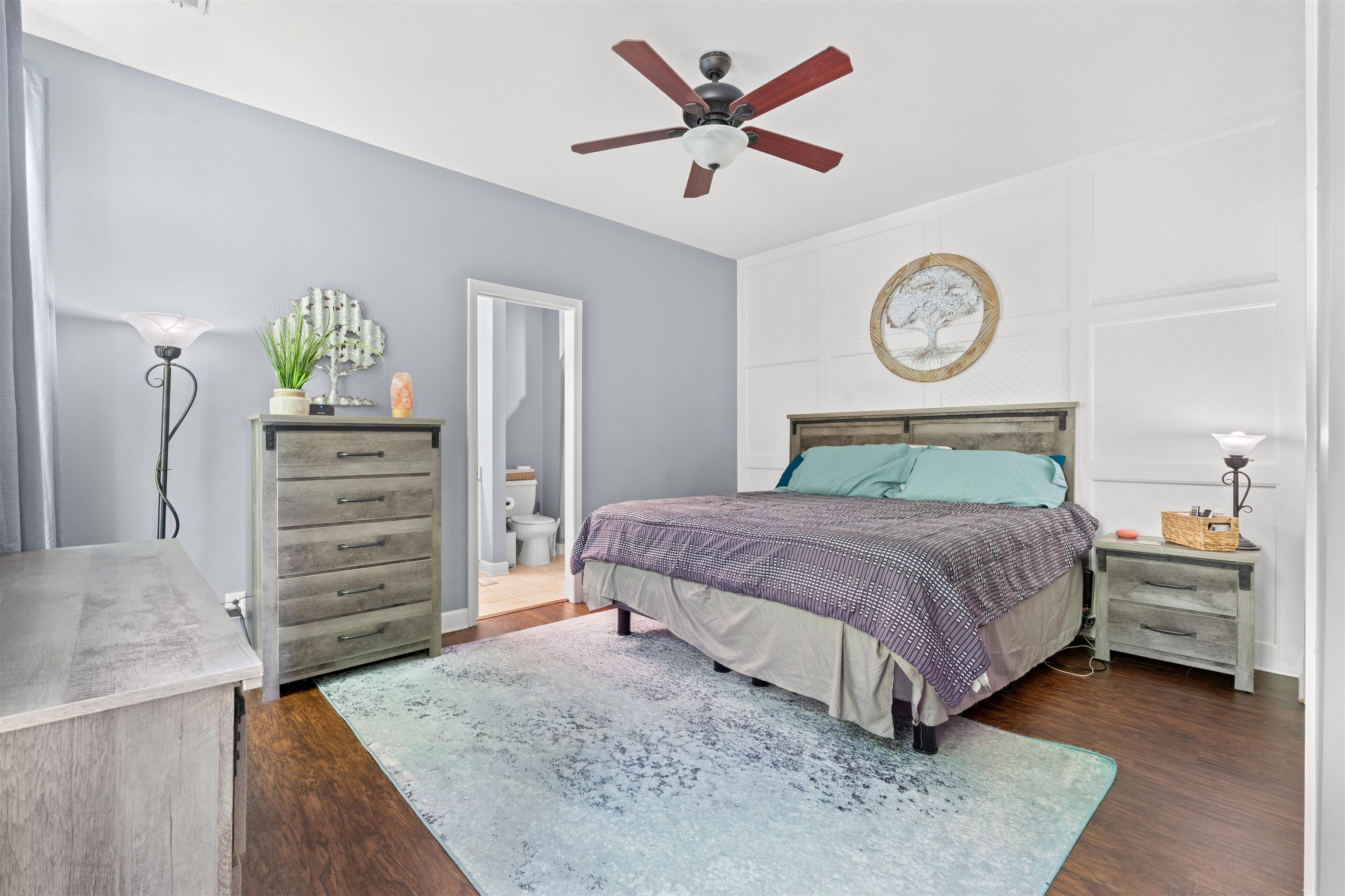 3512 Alexandria Avenue, Unit 18 Myrtle Beach, SC 29577 - Photo 11 of 31 Bedroom with a ceiling fan, connected bathroom, and dark wood-type flooring
