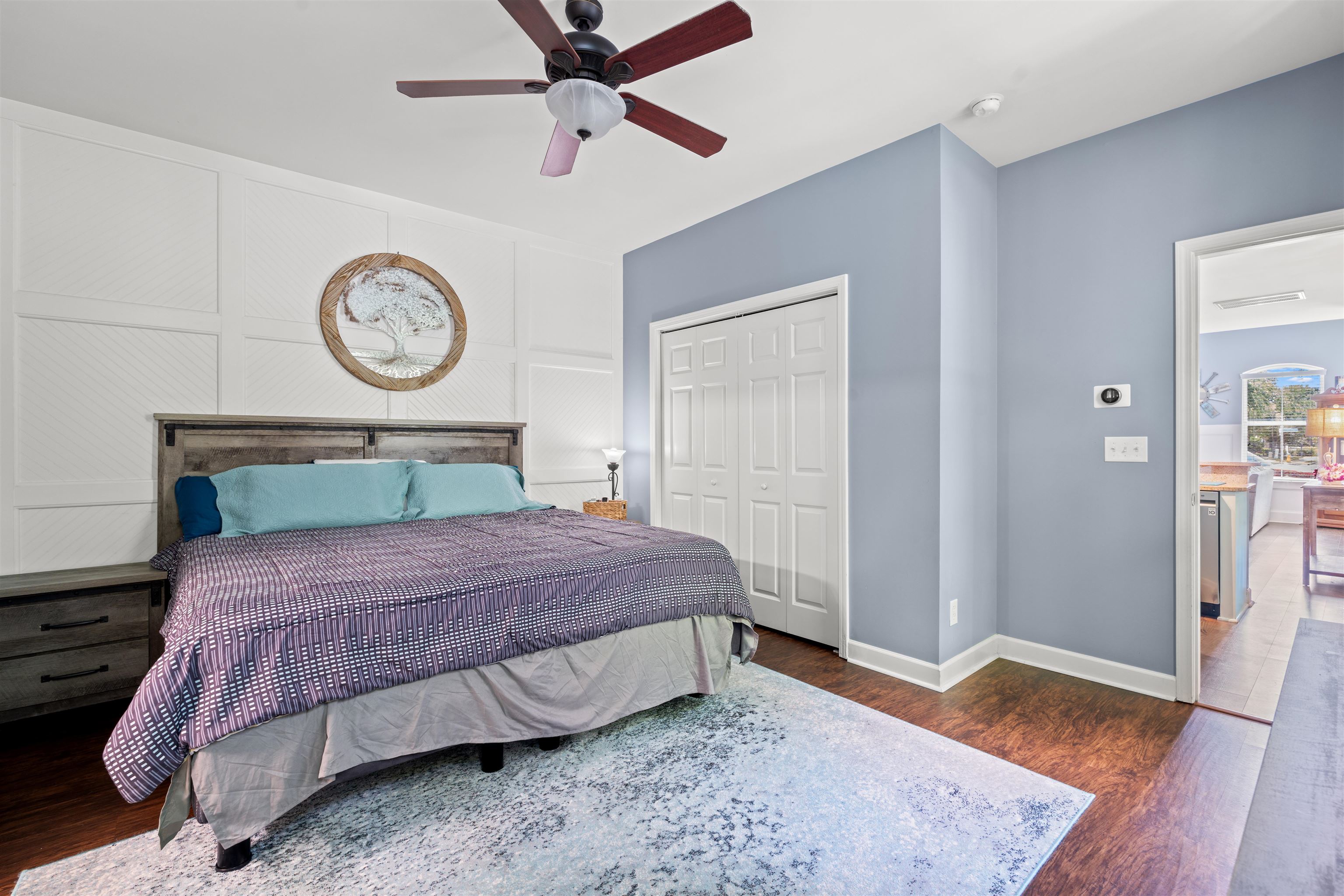 3512 Alexandria Avenue, Unit 18 Myrtle Beach, SC 29577 - Photo 13 of 31 Bedroom featuring a closet, dark wood finished floors, and a ceiling fan