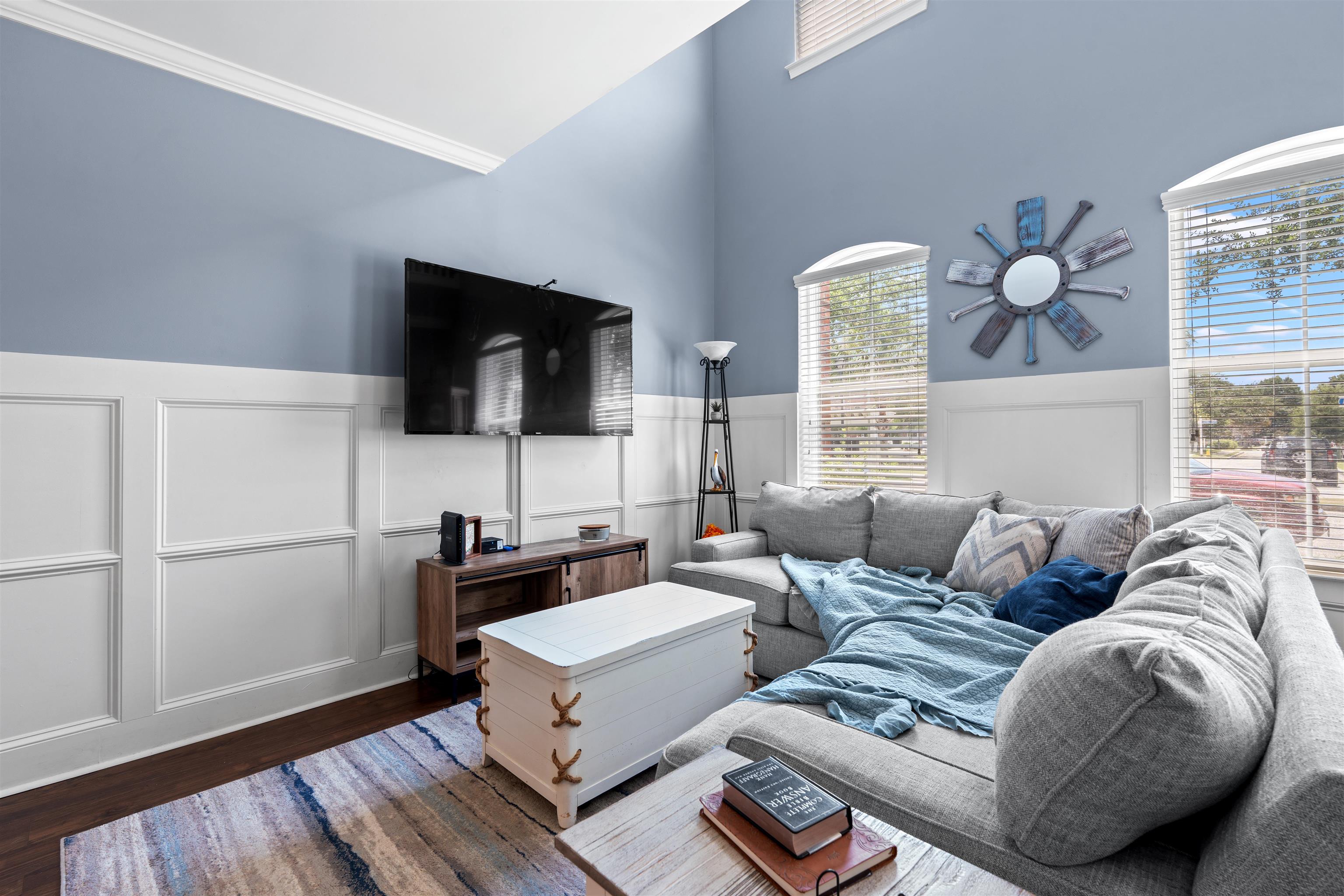 3512 Alexandria Avenue, Unit 18 Myrtle Beach, SC 29577 - Photo 2 of 31 Living room featuring wood finished floors, ornamental molding, a wainscoted wall, and a decorative wall