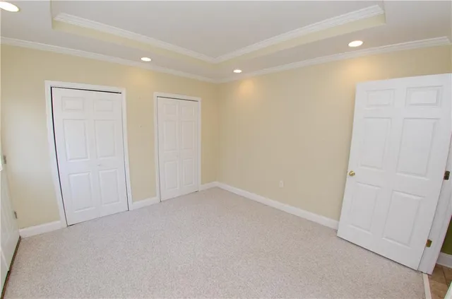 a pathway of a house with a yard