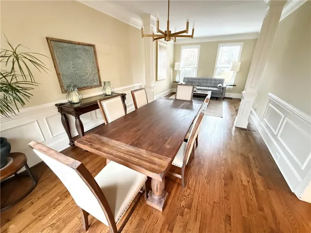 a view of a dining room with furniture window and wooden floor