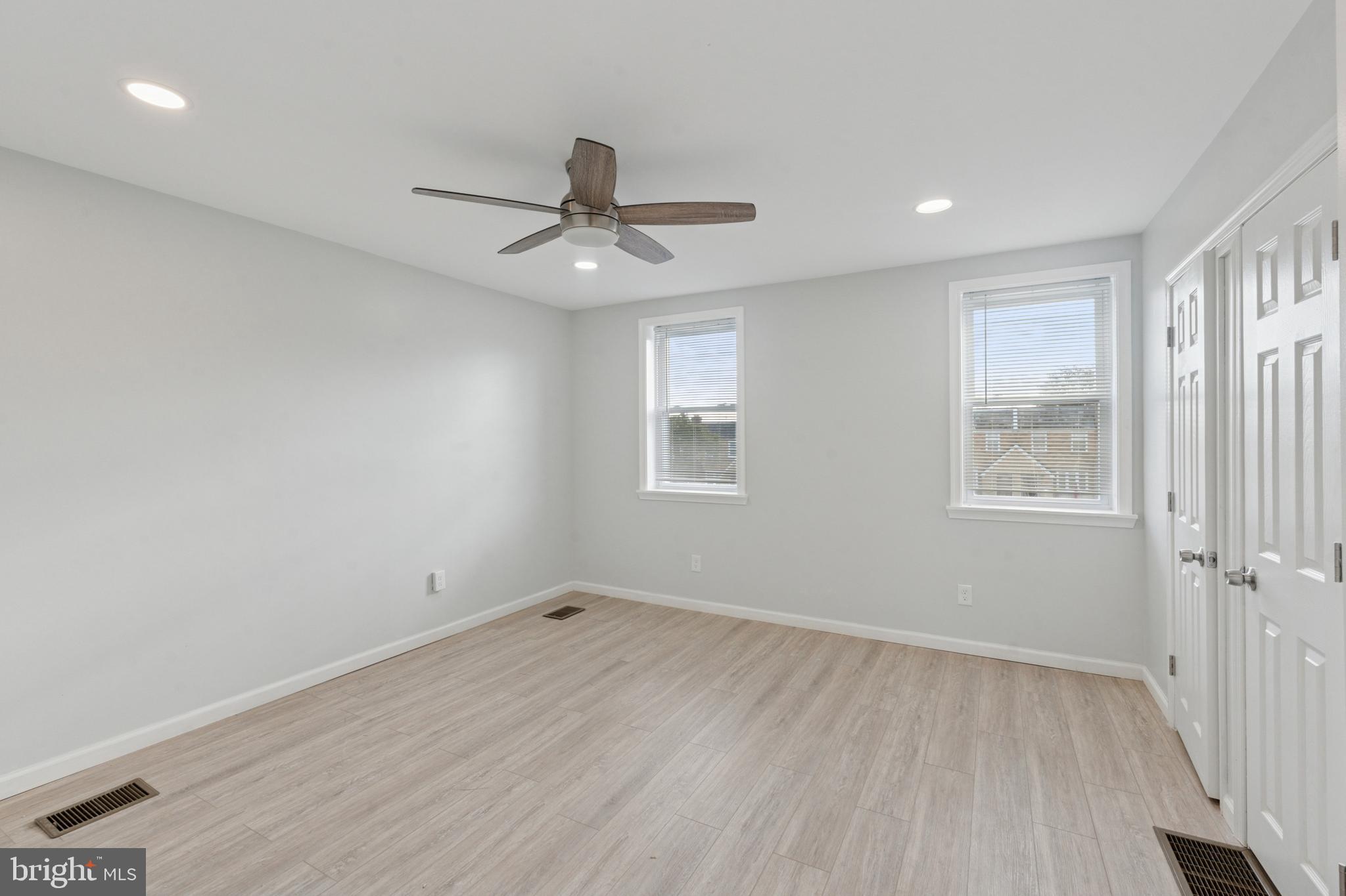 8327 Forrest Avenue Philadelphia, PA 19150 - Photo 11 of 14 a view of empty room with wooden floor and fan