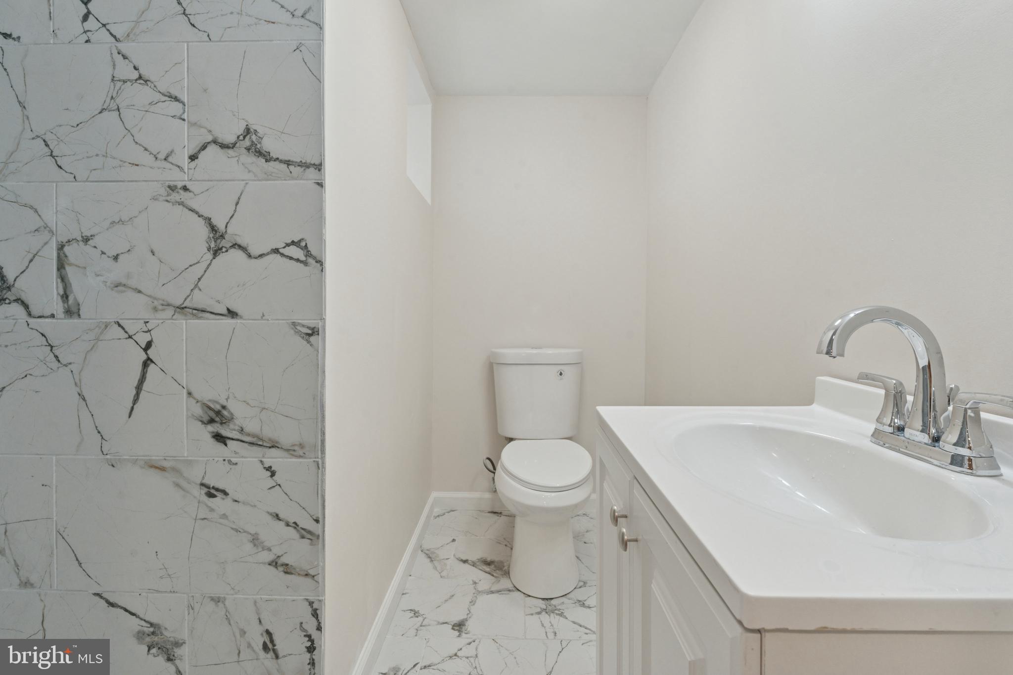 8327 Forrest Avenue Philadelphia, PA 19150 - Photo 13 of 14 a bathroom with a sink and a toilet