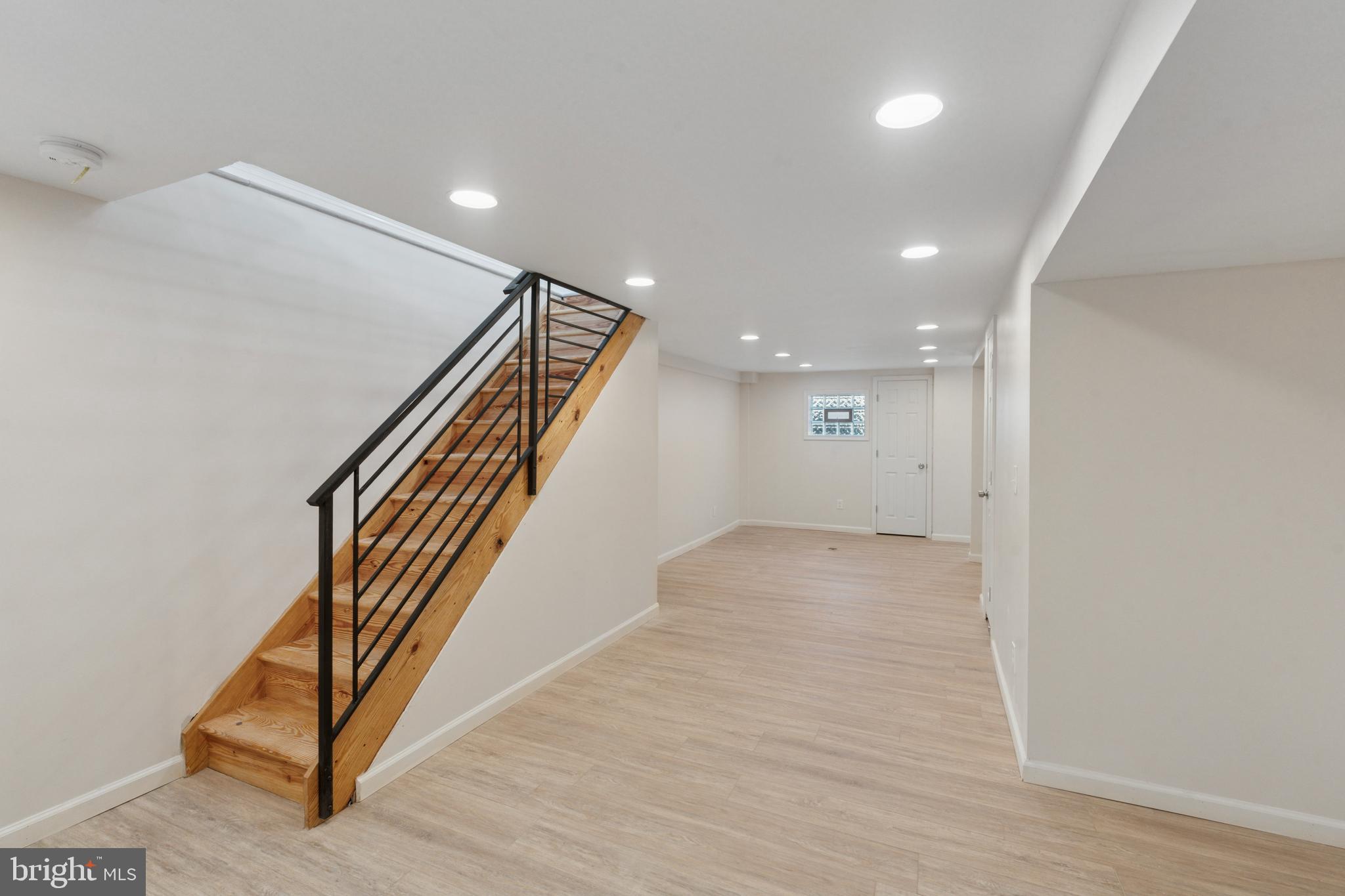 8327 Forrest Avenue Philadelphia, PA 19150 - Photo 6 of 14 an entryway in a hall with wooden floor and a hallway