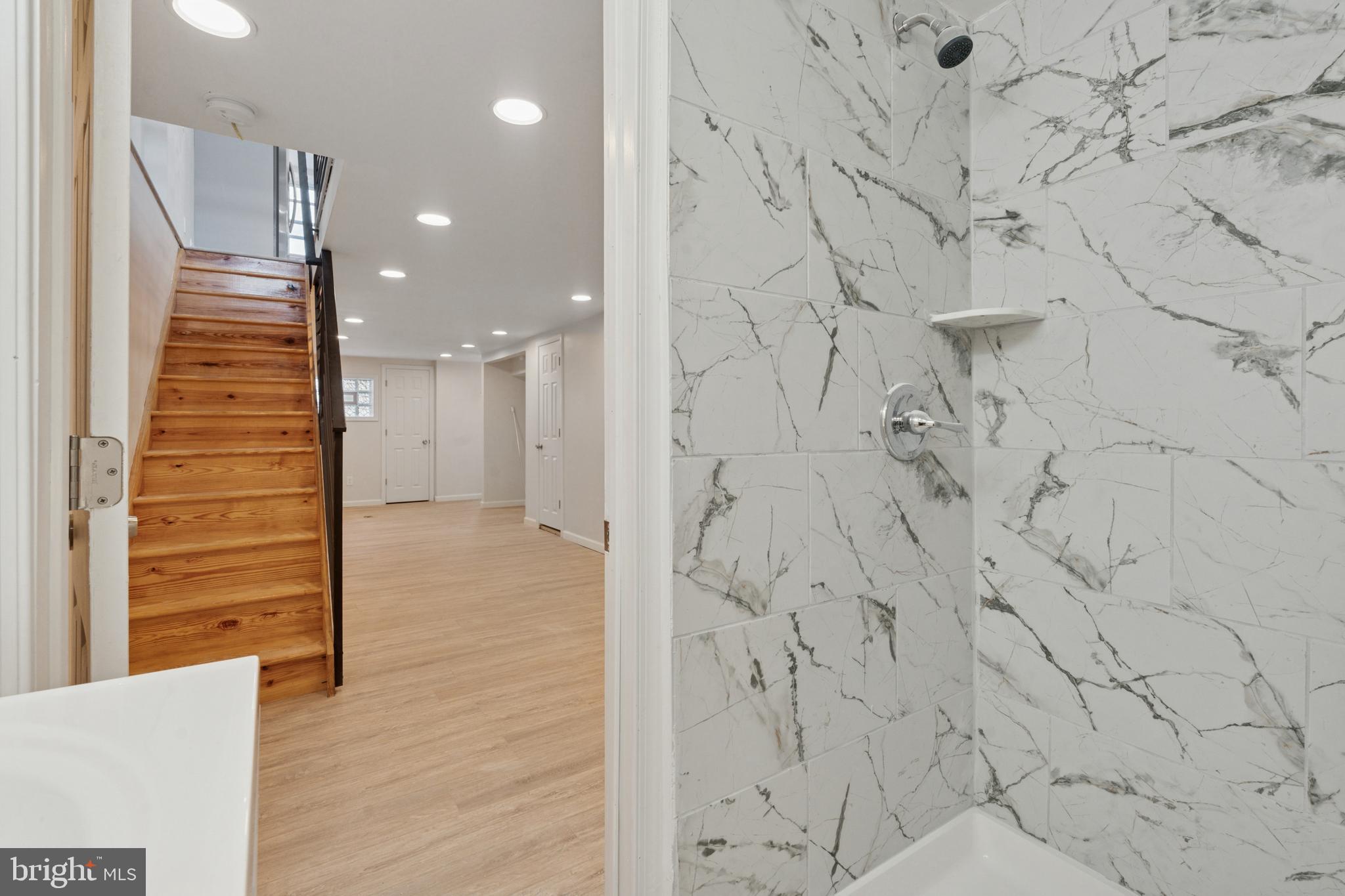 8327 Forrest Avenue Philadelphia, PA 19150 - Photo 7 of 14 a view of a hallway with wooden floor and staircase