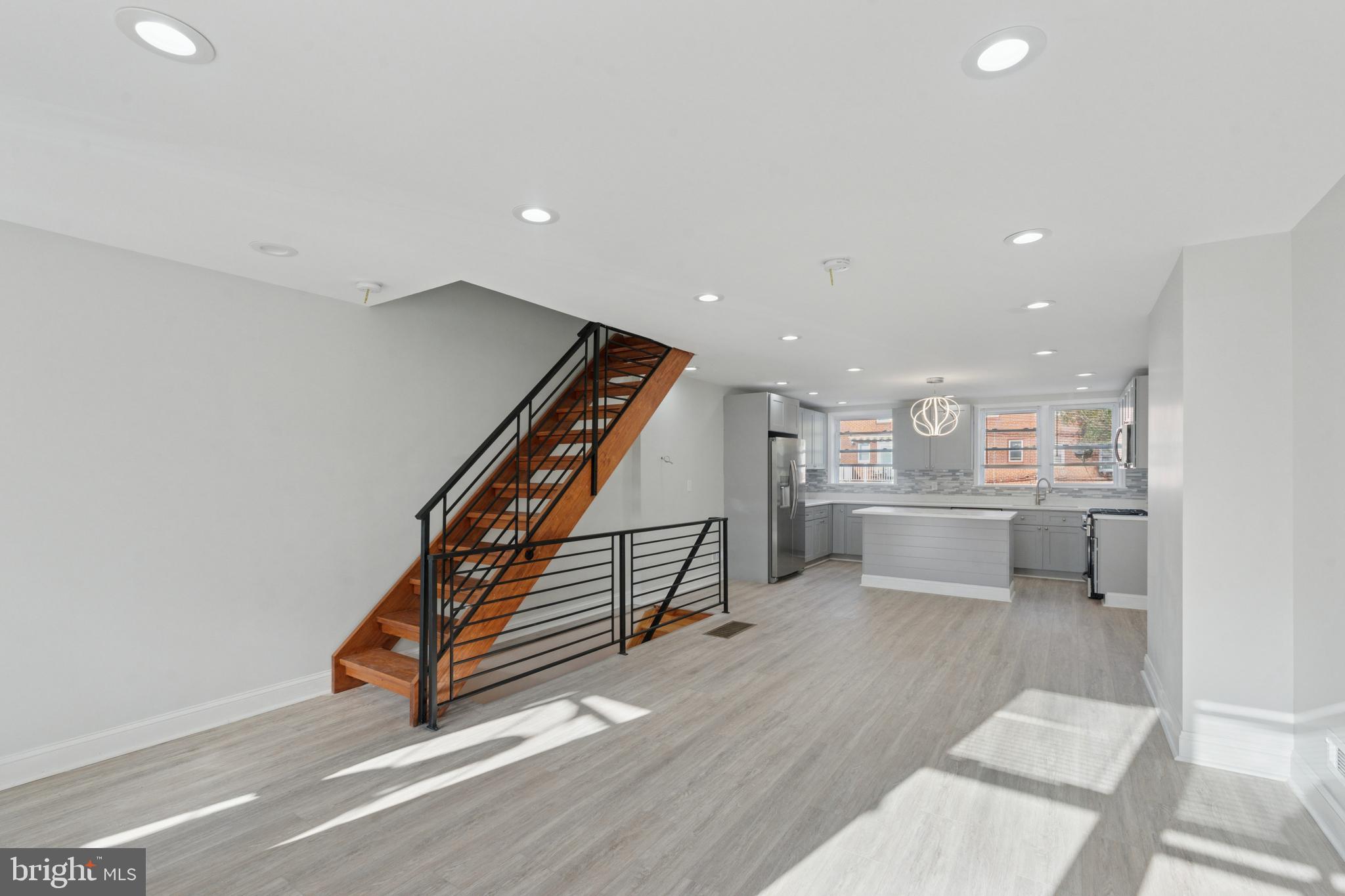 8327 Forrest Avenue Philadelphia, PA 19150 - Photo 8 of 14 a room with wooden floor and stairs