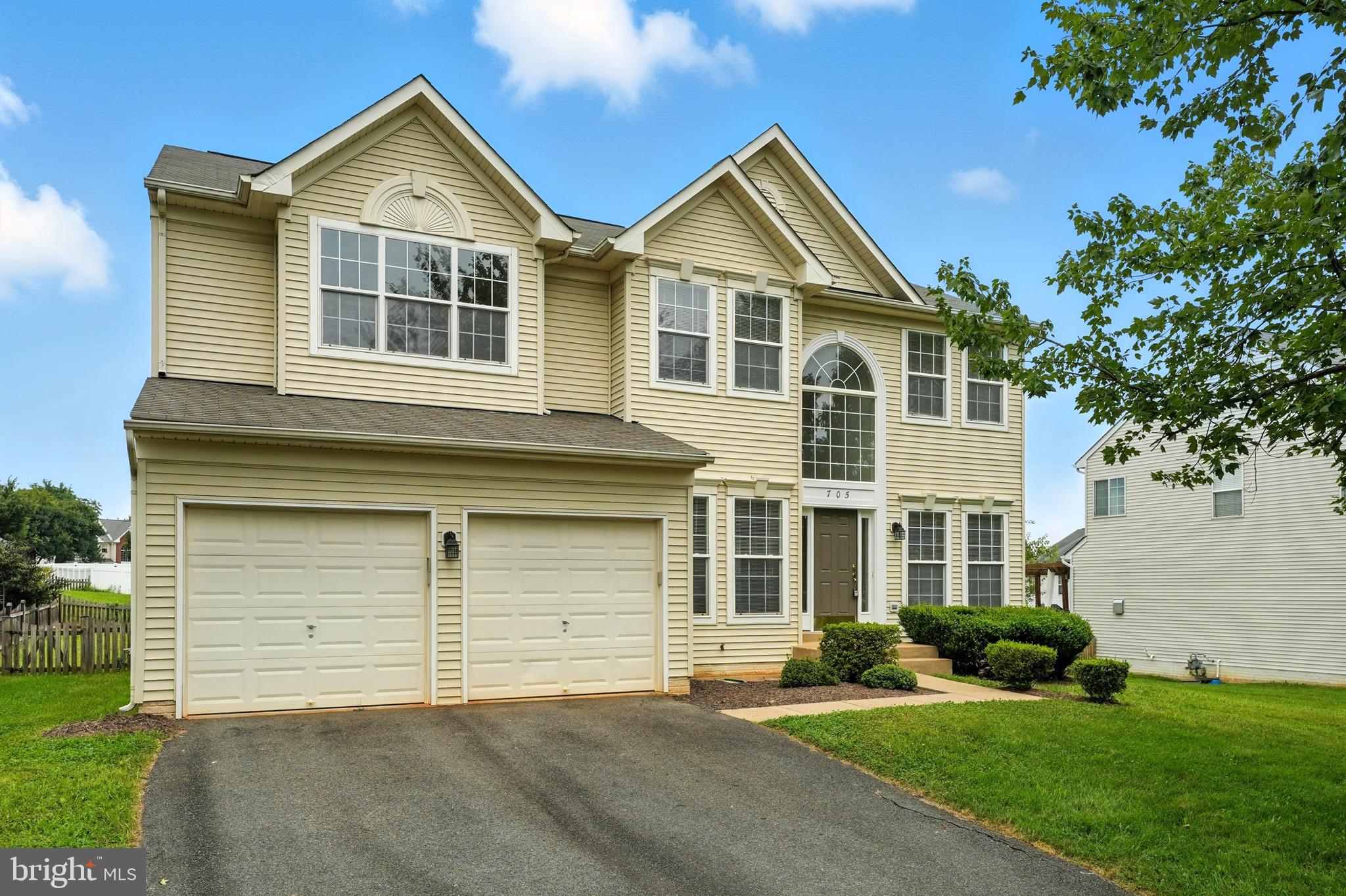 705 Holly Leaf Road Culpeper, VA 22701 - Photo 1 of 62 a front view of a house with a yard and garage