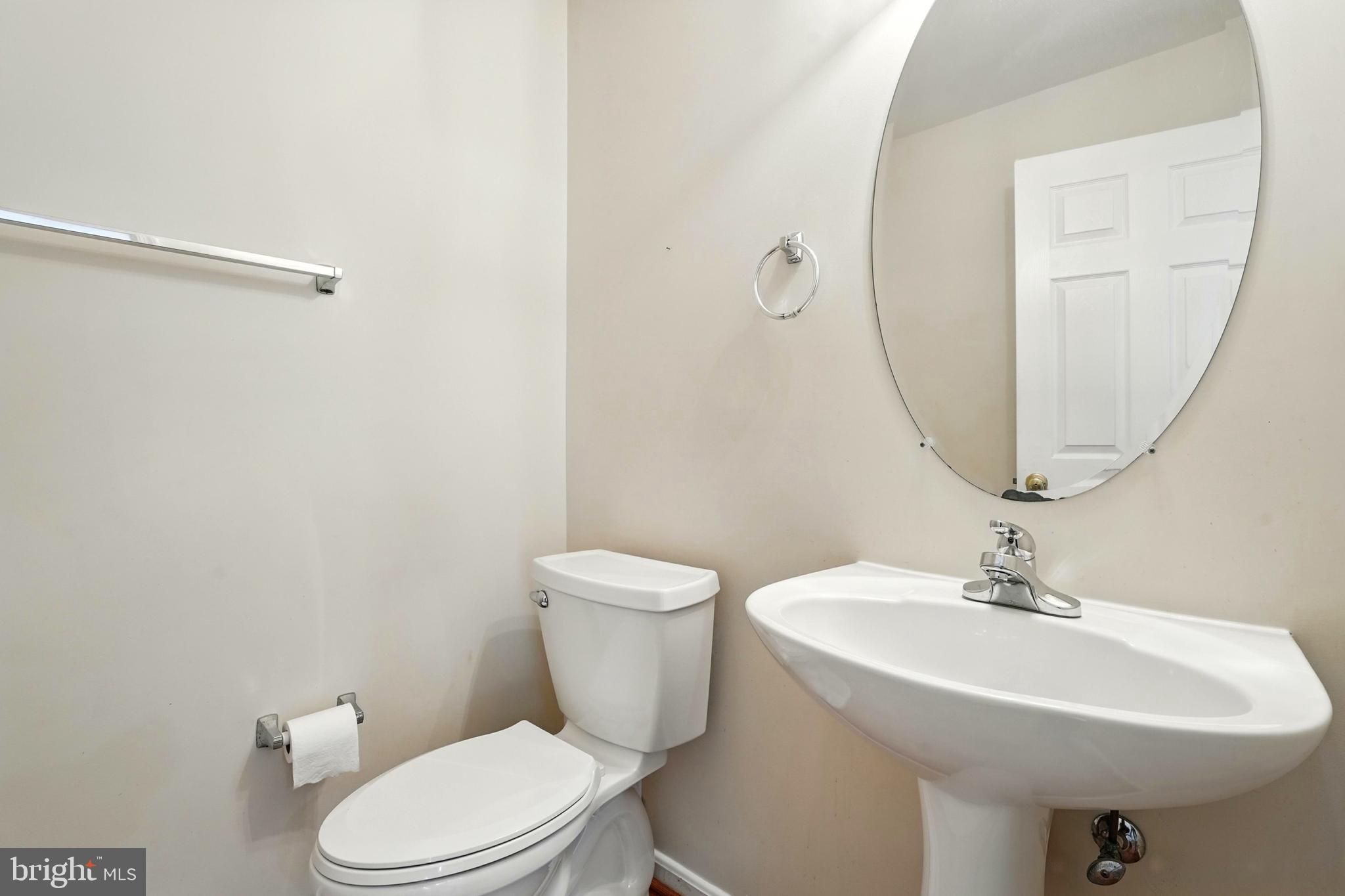 705 Holly Leaf Road Culpeper, VA 22701 - Photo 15 of 62 a bathroom with a sink a toilet and mirror