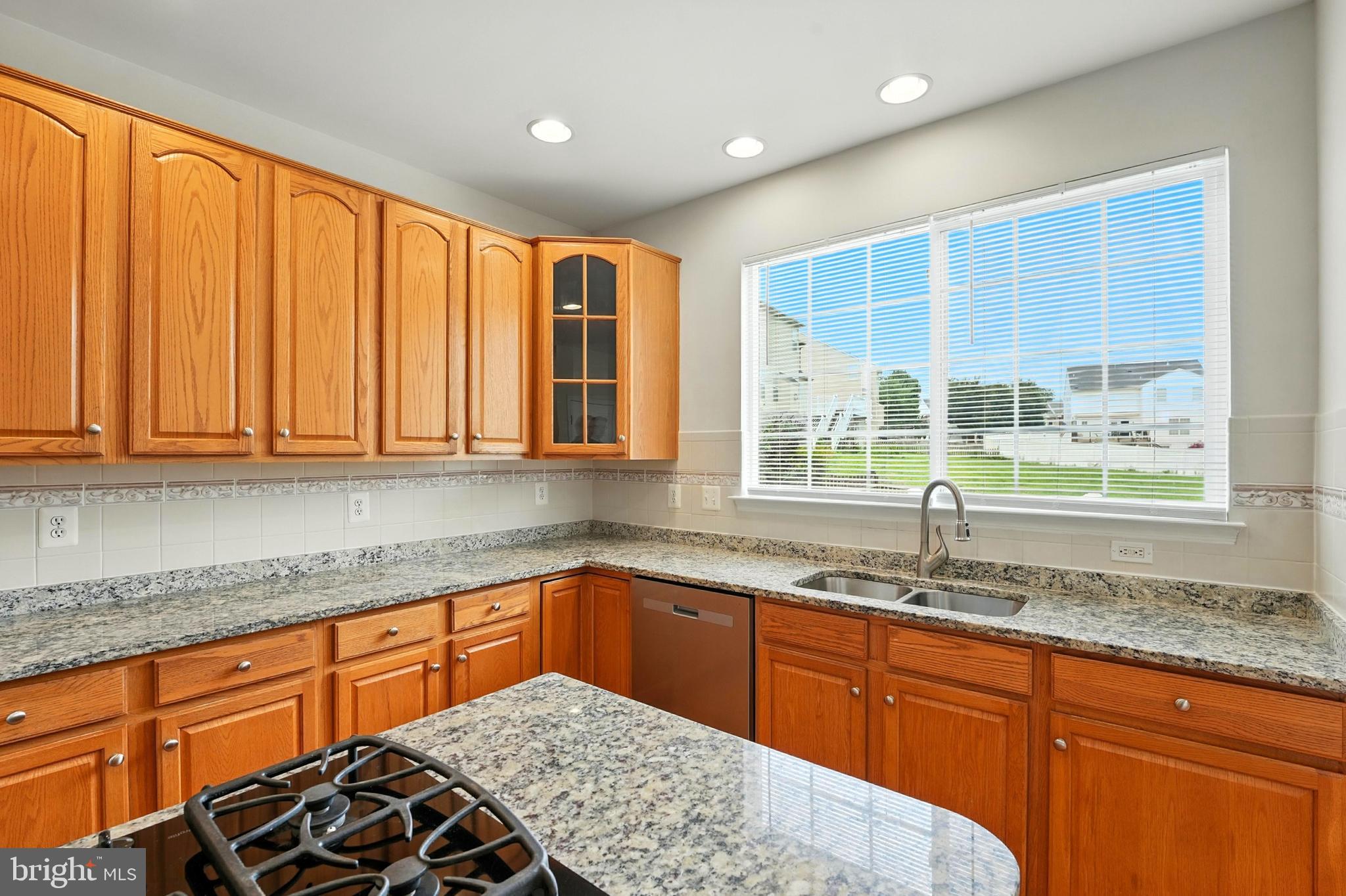 705 Holly Leaf Road Culpeper, VA 22701 - Photo 26 of 62 a kitchen with stainless steel appliances granite countertop a sink stove and cabinets